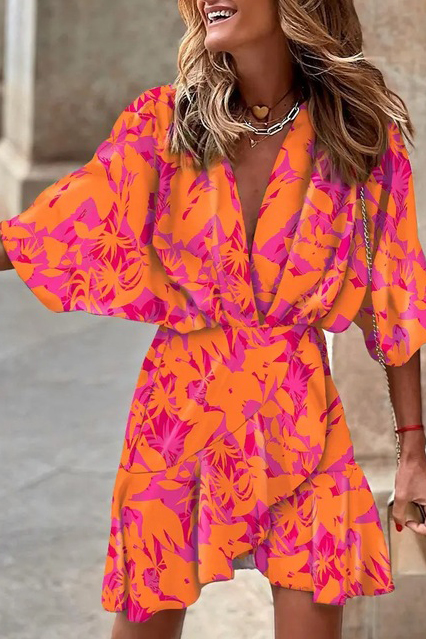 Elegant fuchsia mini dress with print, featuring a deep neckline, short sleeves, and a decorative belt, perfect for various occasions.