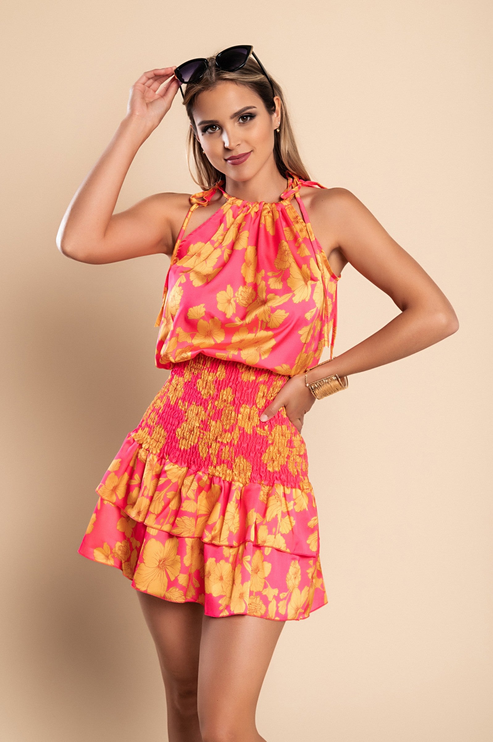 Elegant fuchsia mini dress Torsa with print, featuring a round neckline, thin shoulder straps, and a ruffled mid-thigh skirt.