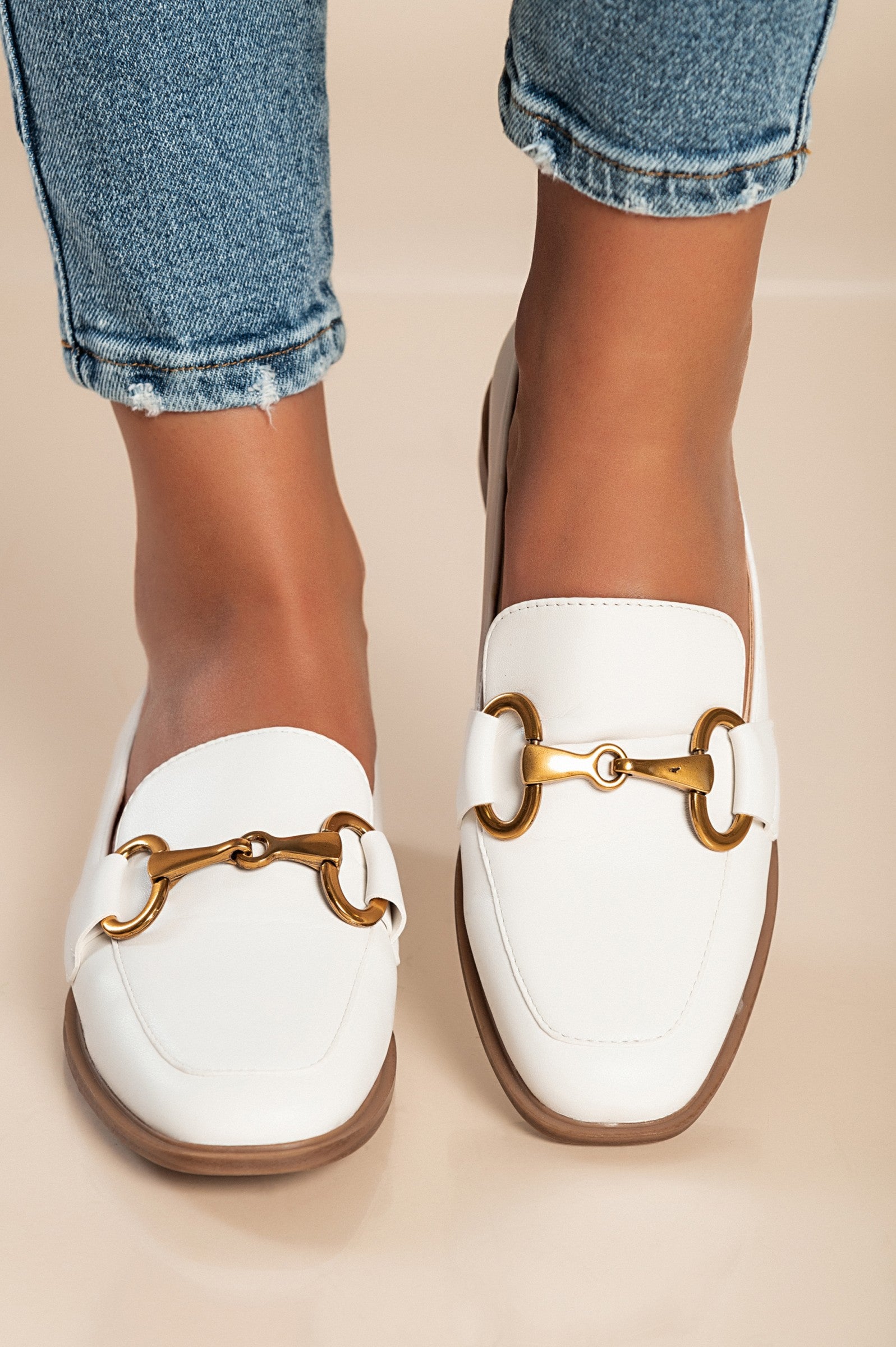 Elegant white moccasins V7T88801 with decorative detail and flat sole, showcasing quality craftsmanship.