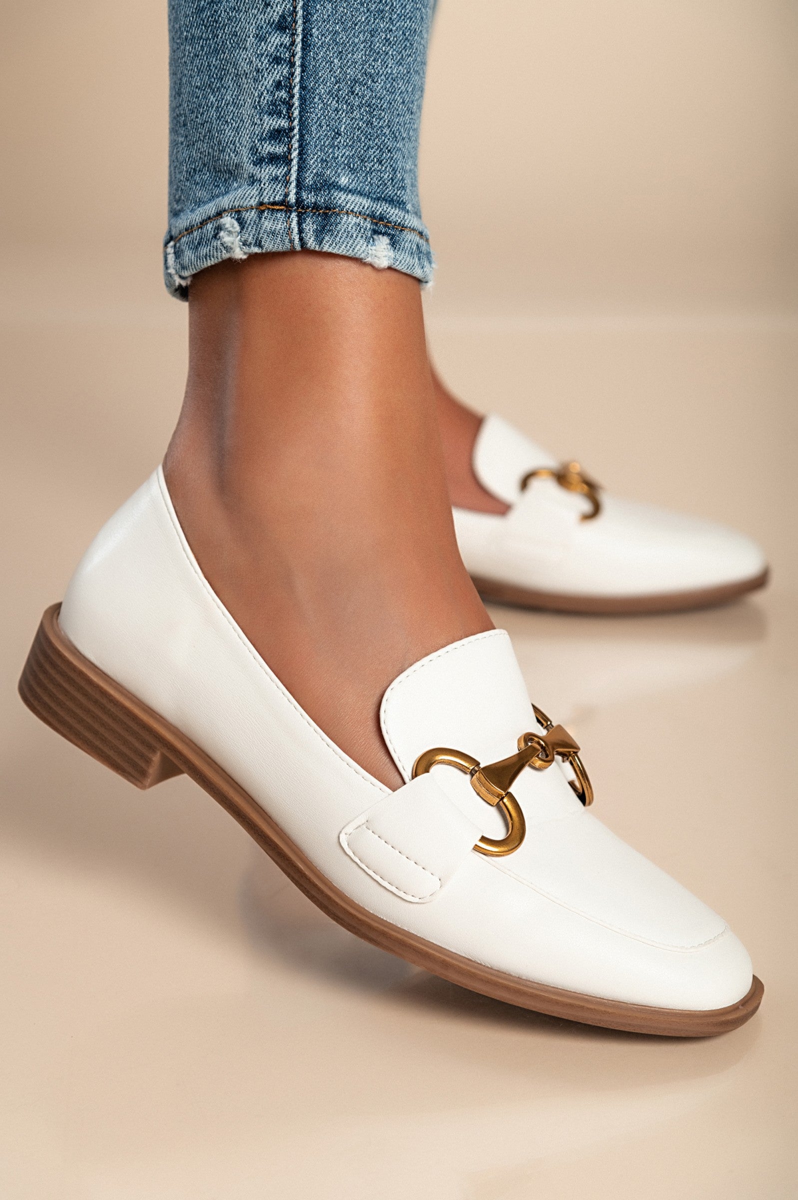Elegant white moccasins V7T88801 with decorative detail and flat sole, showcasing quality craftsmanship.