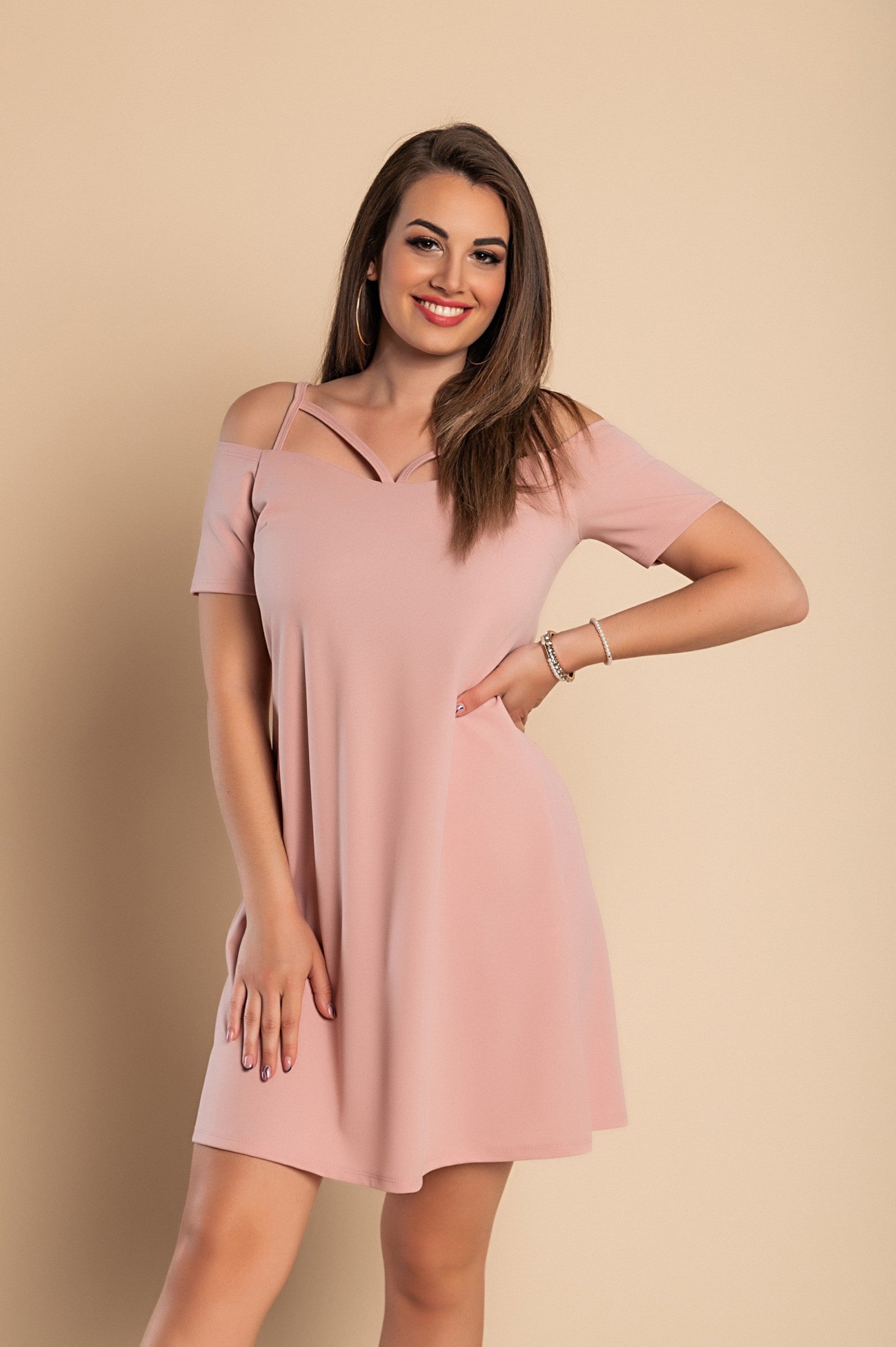 Elegant pink off-shoulder strappy mini dress Cecina with short sleeves and loose skirt, perfect for various occasions.