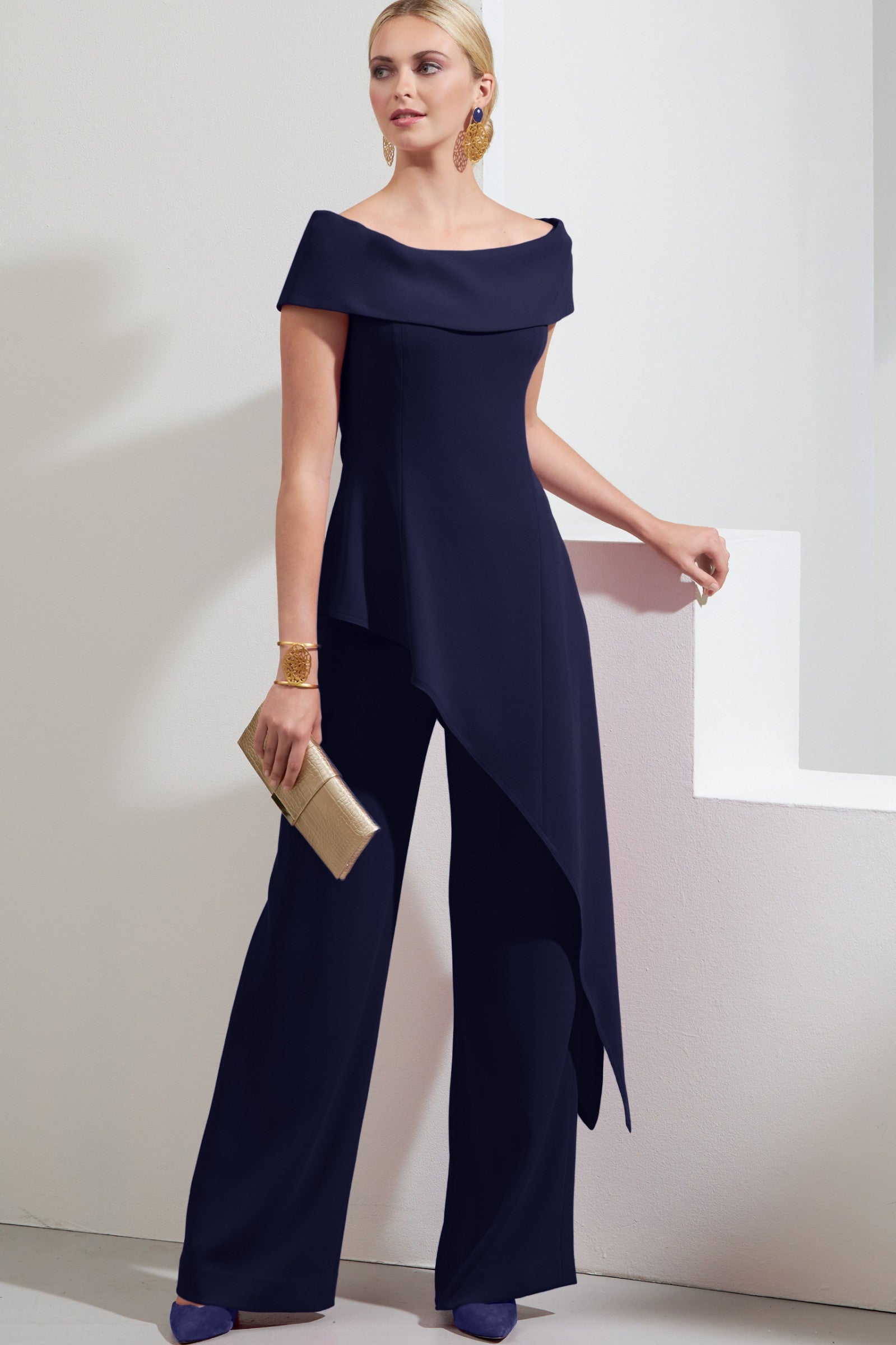 Elegant dark blue asymmetrical top and loose trousers set, showcasing bateau neckline and short sleeves.