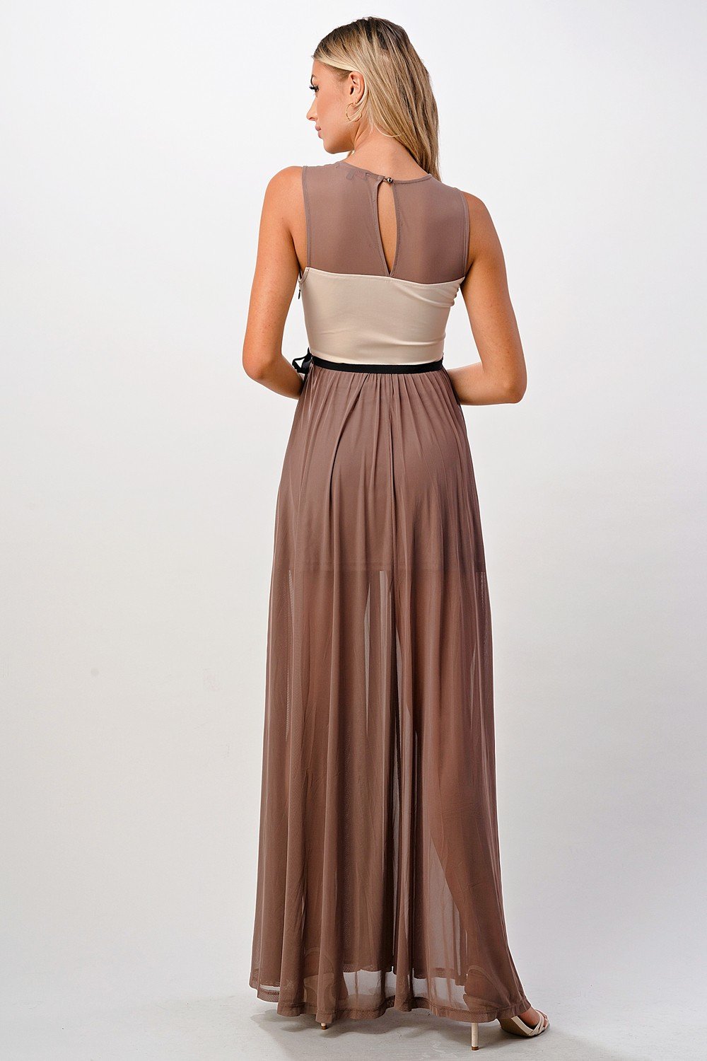 Elegant sheer maxi dress featuring a lace bodice and flowing skirt, perfect for special occasions.