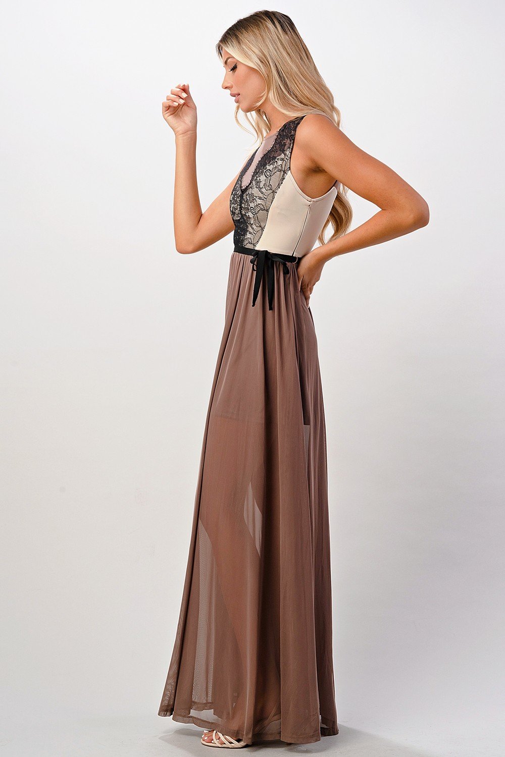 Elegant sheer maxi dress featuring a lace bodice and flowing skirt, perfect for special occasions.