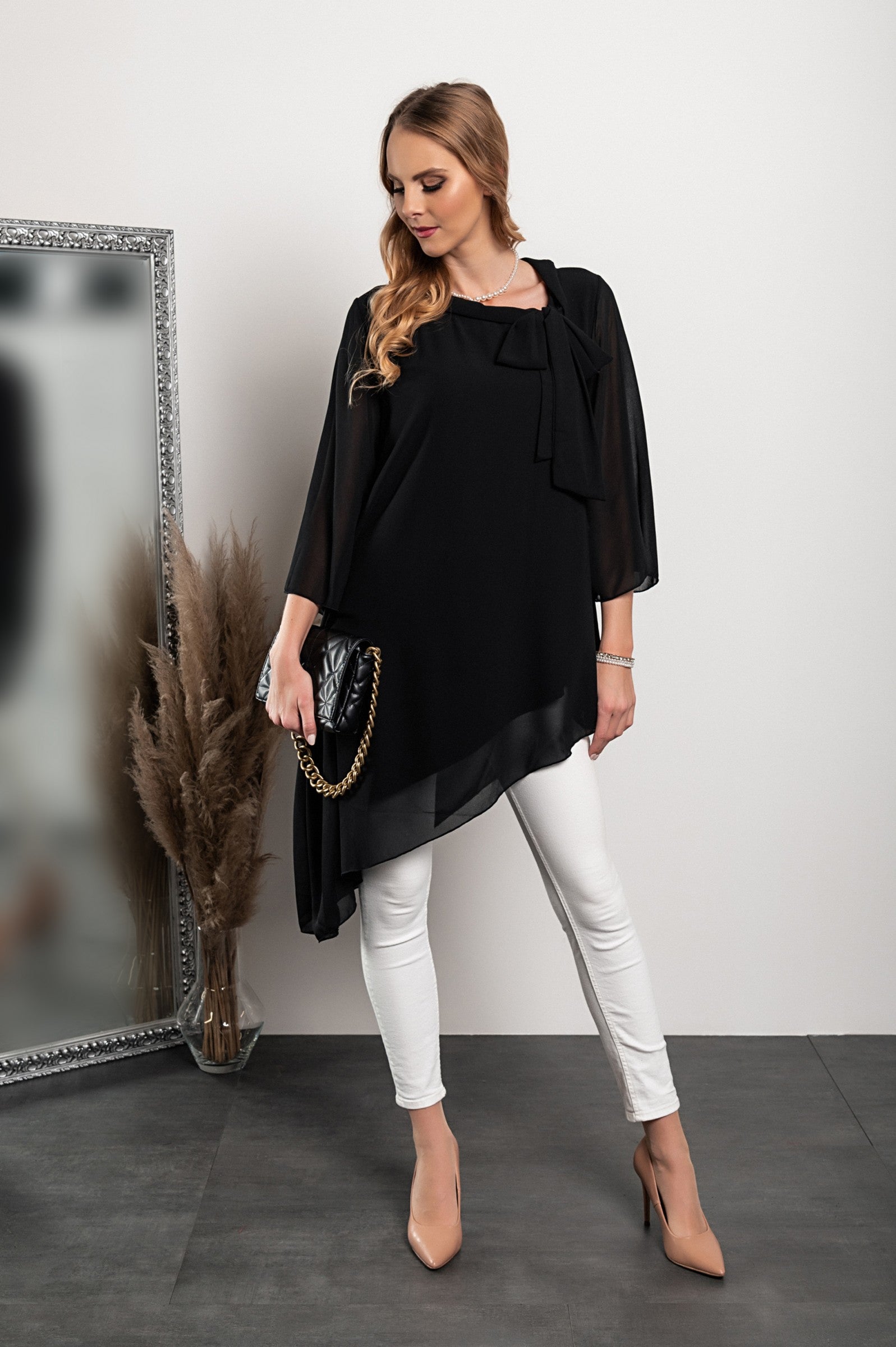 Elegant black translucent tunic Ginette with loose sleeves and bow tie collar, showcasing high-quality Italian craftsmanship.