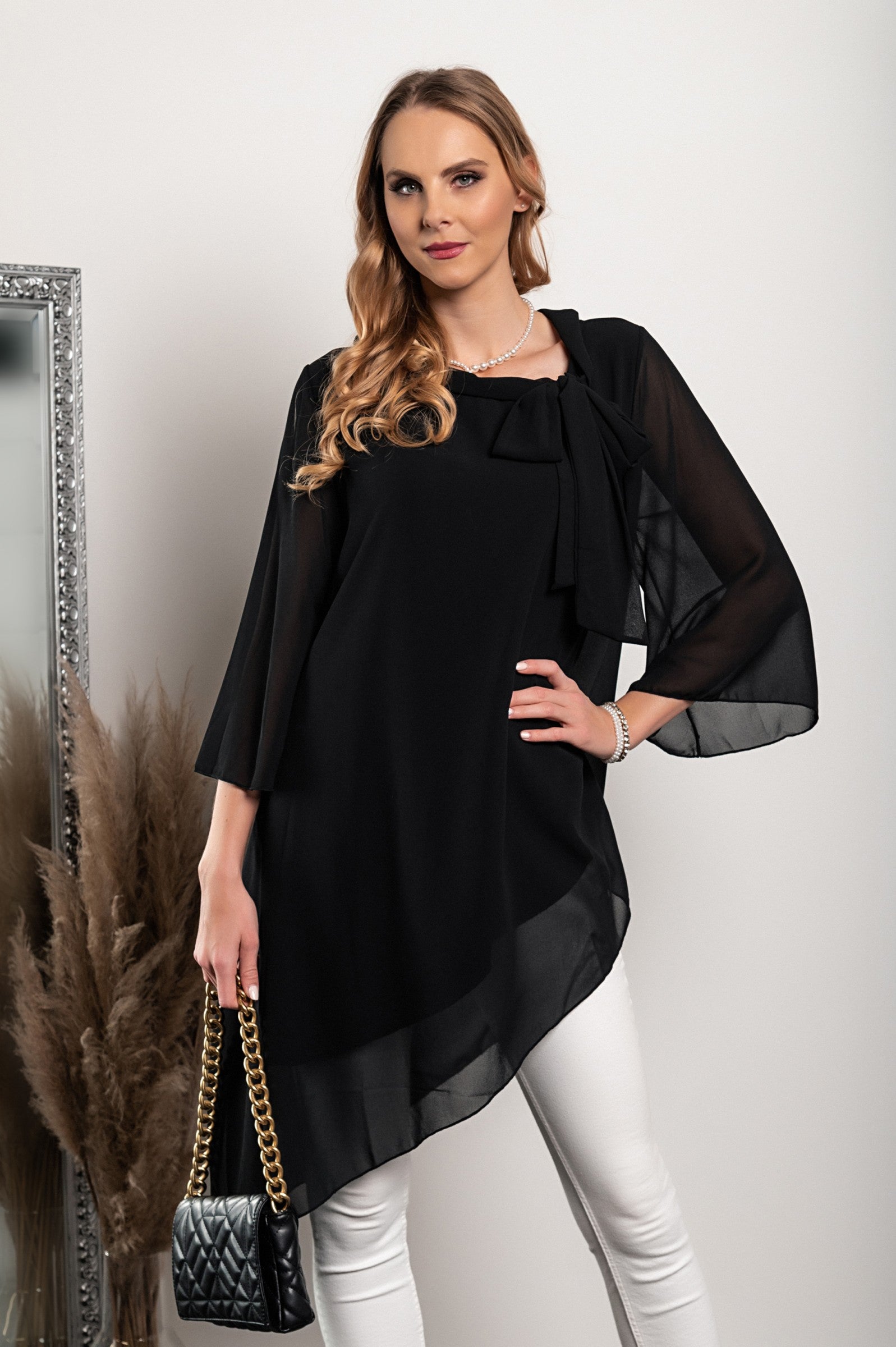 Elegant black translucent tunic Ginette with loose sleeves and bow tie collar, showcasing high-quality Italian craftsmanship.