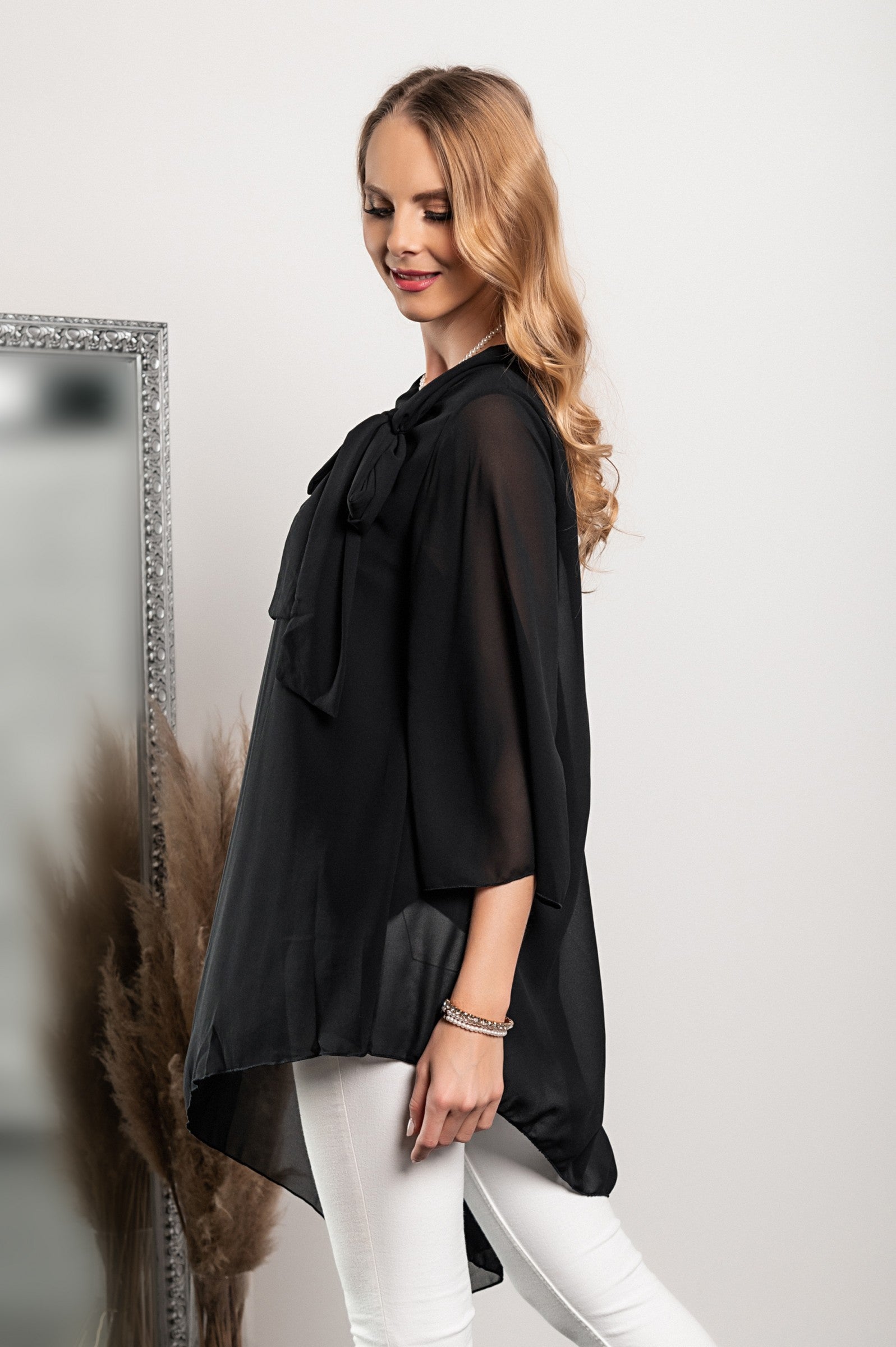 Elegant black translucent tunic Ginette with loose sleeves and bow tie collar, showcasing high-quality Italian craftsmanship.