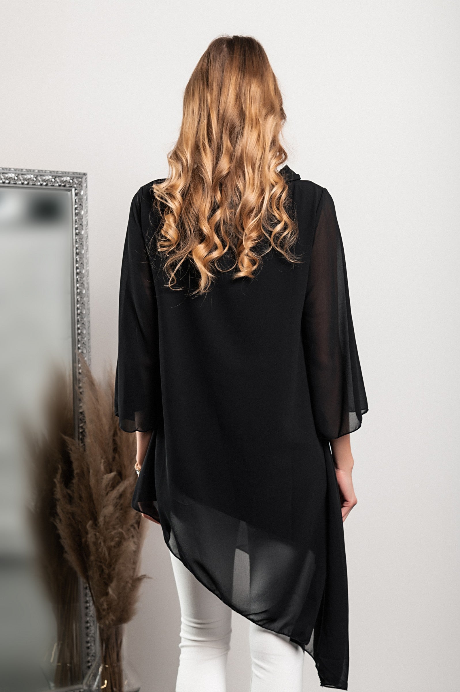 Elegant black translucent tunic Ginette with loose sleeves and bow tie collar, showcasing high-quality Italian craftsmanship.