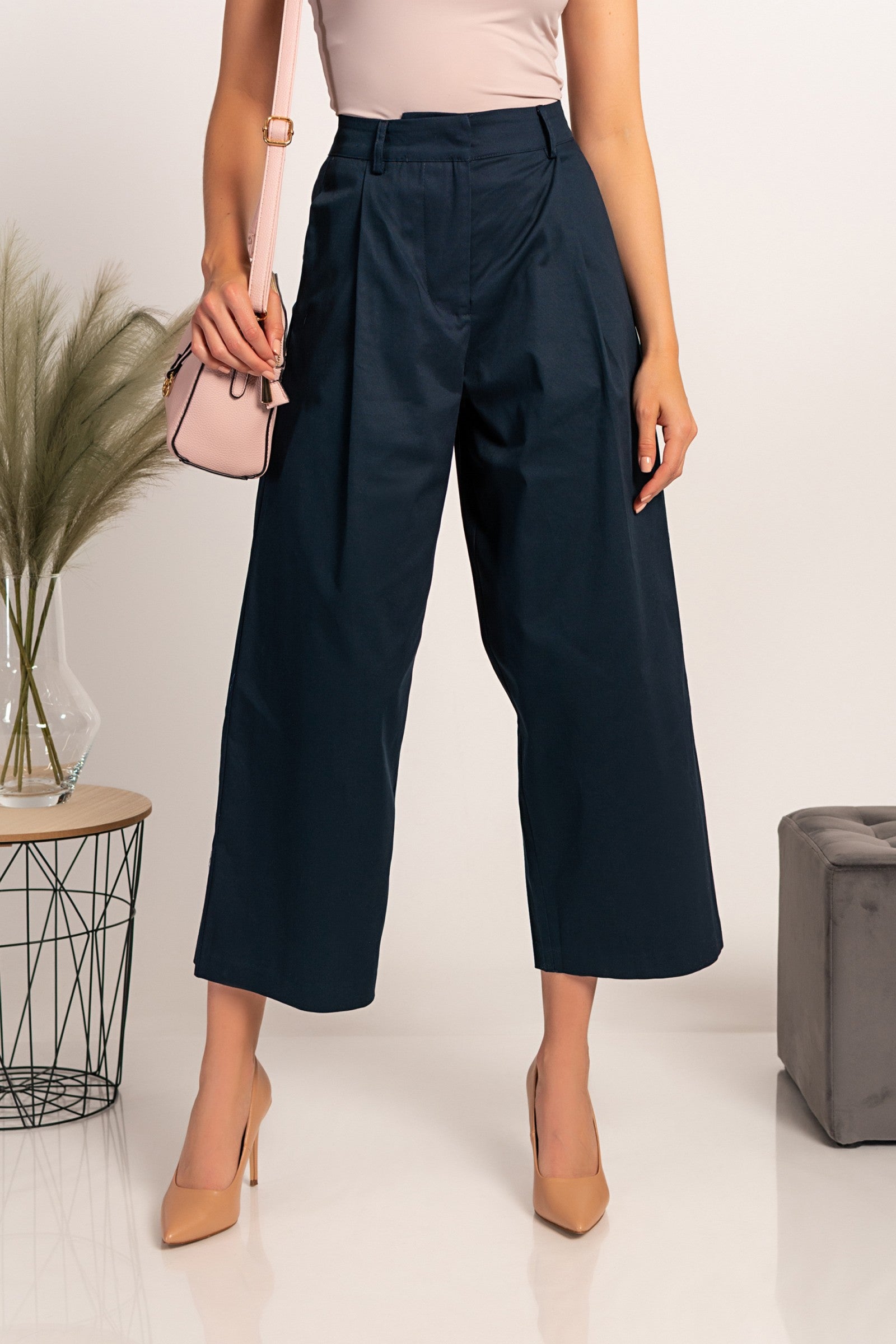 Elegant dark blue wide-leg trousers with zip closure and metal hook, made from high-quality cotton, showcasing a stylish and comfortable design.