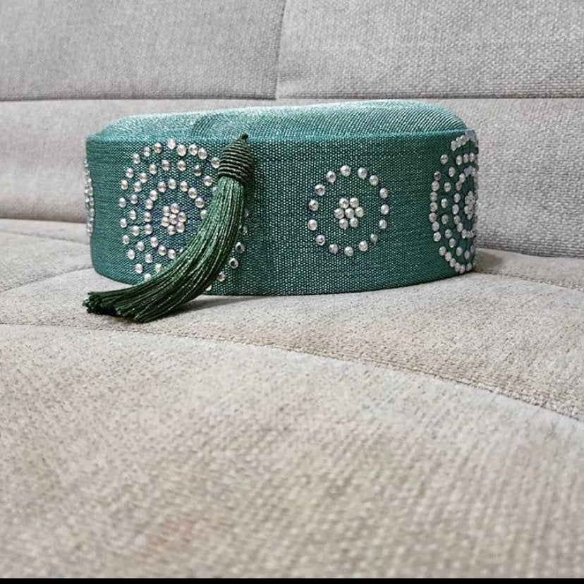 Embellished Asooke African hat for men featuring tassels and Swarovski stones in vibrant colors.