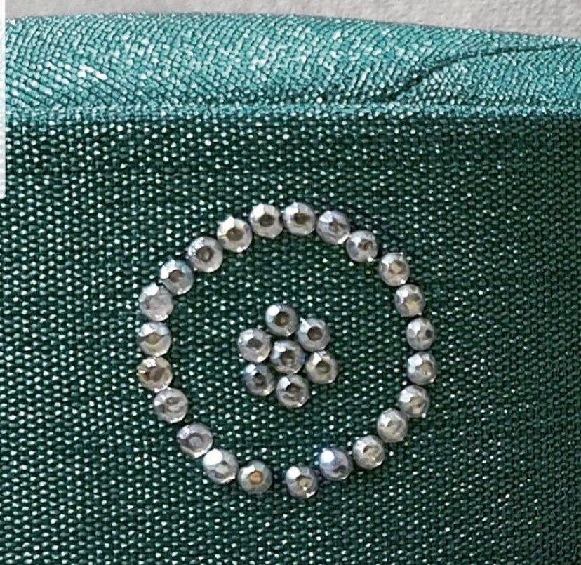 Embellished Asooke African hat for men featuring tassels and Swarovski stones in vibrant colors.