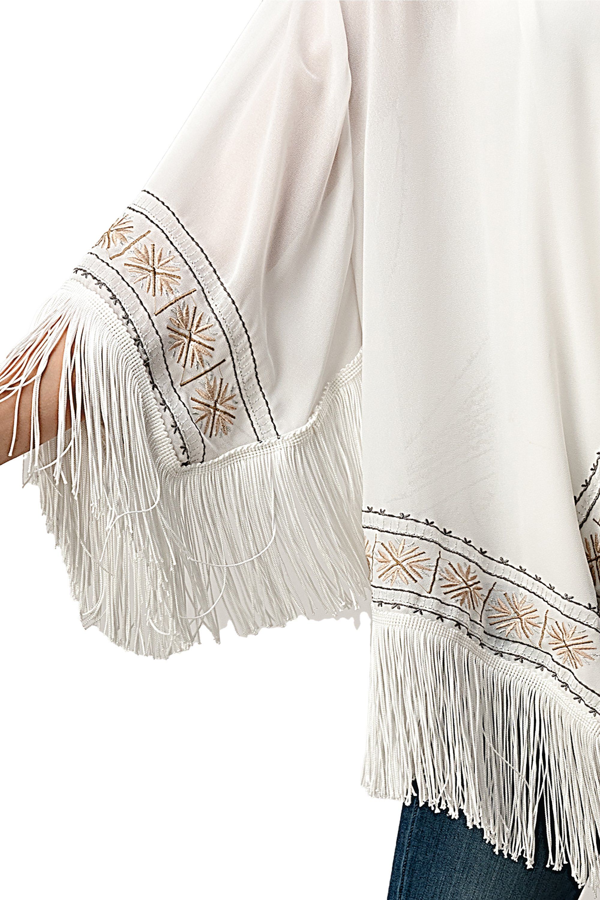 Embroidered Fringe Kimono in georgette fabric with tassel hem, showcasing intricate patterns and a bohemian style.