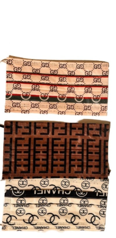 A collection of stylish face masks featuring FF, GG, CC, LV, and Burberry designs, showcasing their unique patterns and colors.