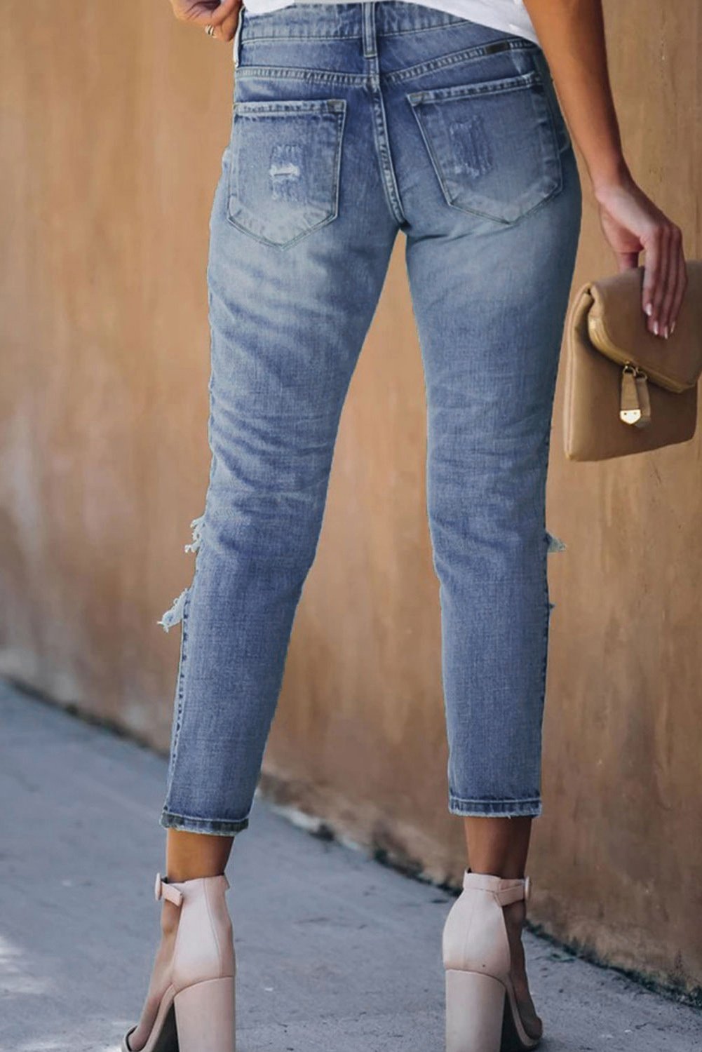 Fading Distressed Holes Crop Jeans featuring a light wash, classic 5-pocket design, and stylish distressed details.
