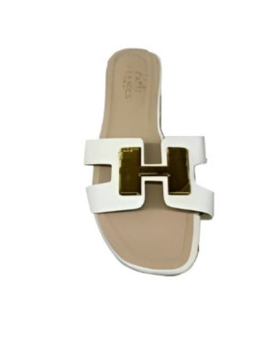 A pair of stylish women's fashion slide sandals with open toe and cut-out strap design, made from genuine leather.