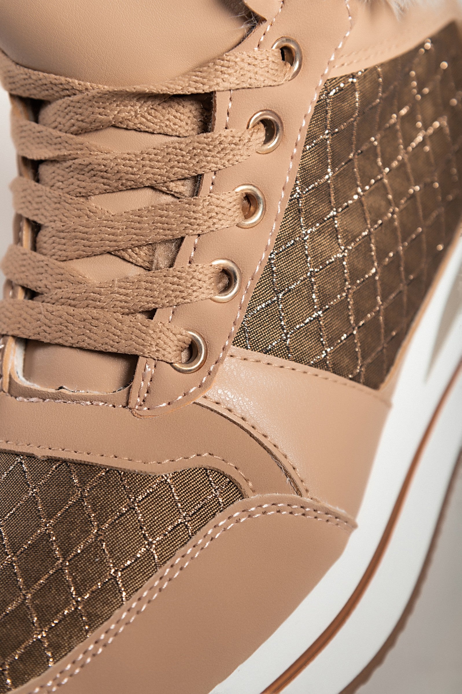 Camel fashion sneakers made of faux leather and textile, featuring a raised sole, round toe, and synthetic fur around the ankle.