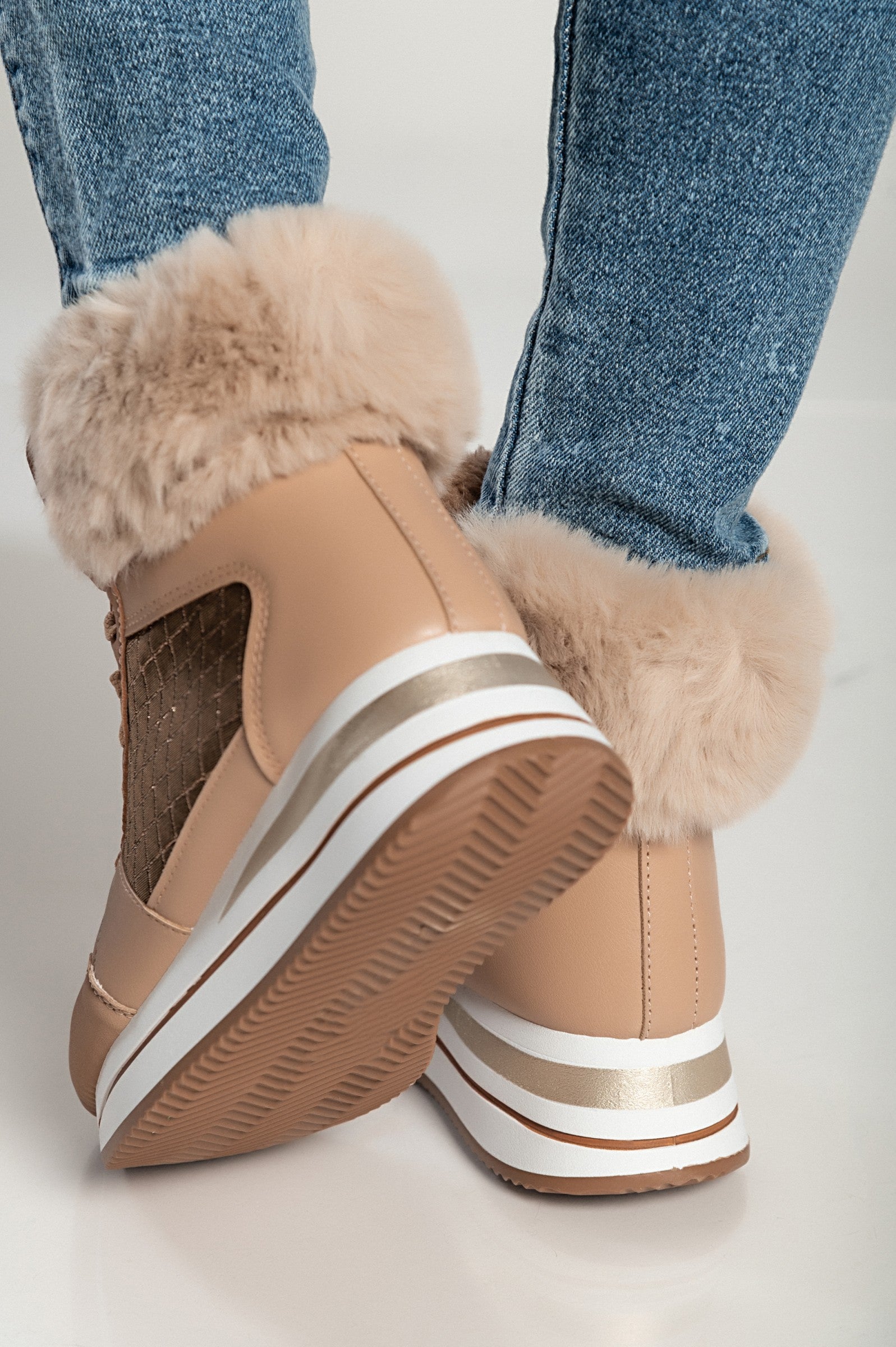 Camel fashion sneakers made of faux leather and textile, featuring a raised sole, round toe, and synthetic fur around the ankle.