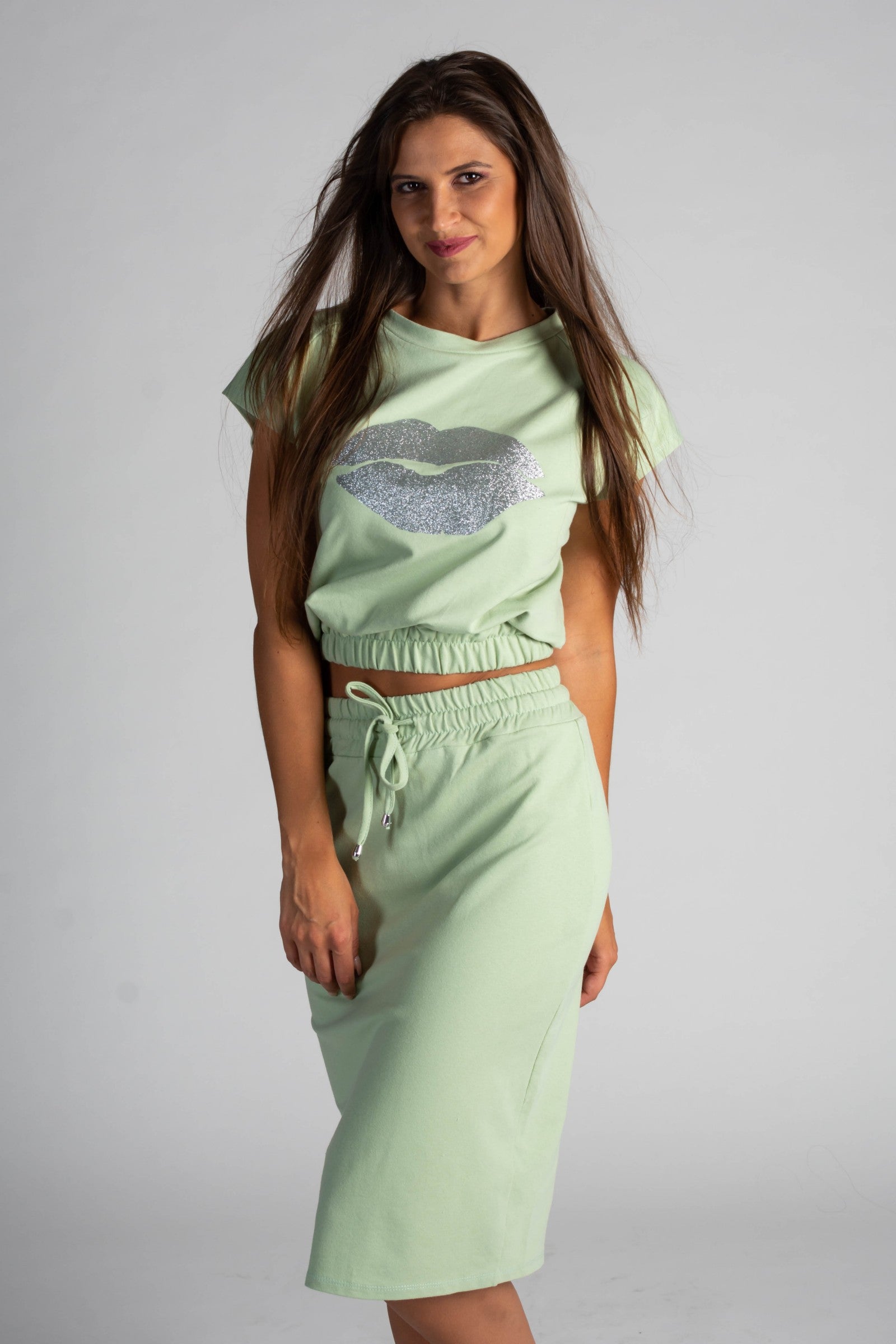 Fashionable mint cropped T-shirt and midi skirt set with print, showcasing a stylish design and comfortable fit.