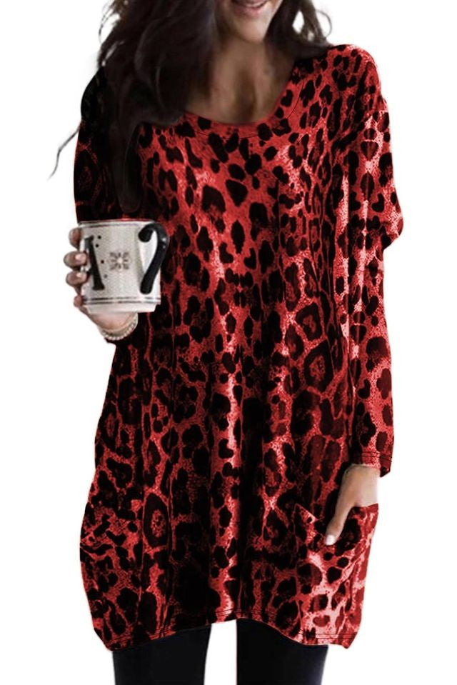 Fashionable tunic featuring long sleeves, leopard print, and front pockets, designed for comfort and style.