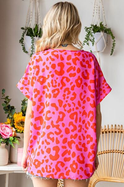 First Love Leopard V-Neck Short Sleeve Woven Top featuring a trendy leopard print design, lightweight fabric, and flattering v-neckline.