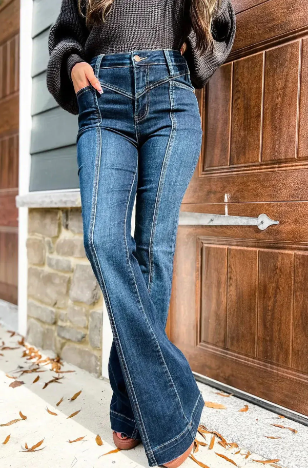 A pair of stylish blue flared jeans featuring a high waist, button and zipper closure, and side pockets, showcasing a bell-shaped leg design.