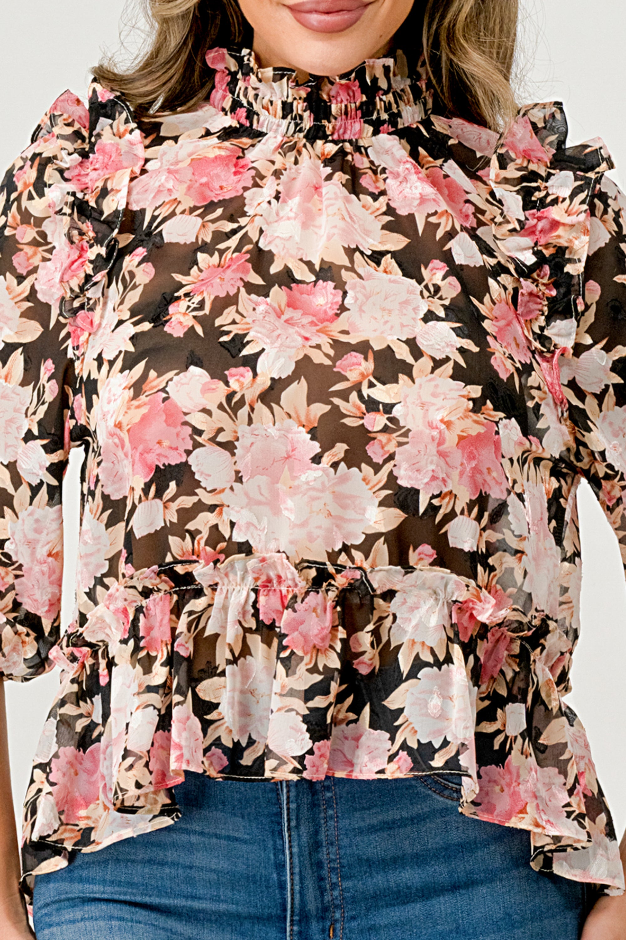 Floral High-Neck Ruffle Blouse featuring ruffle details and a hi-low design in floral chiffon fabric.