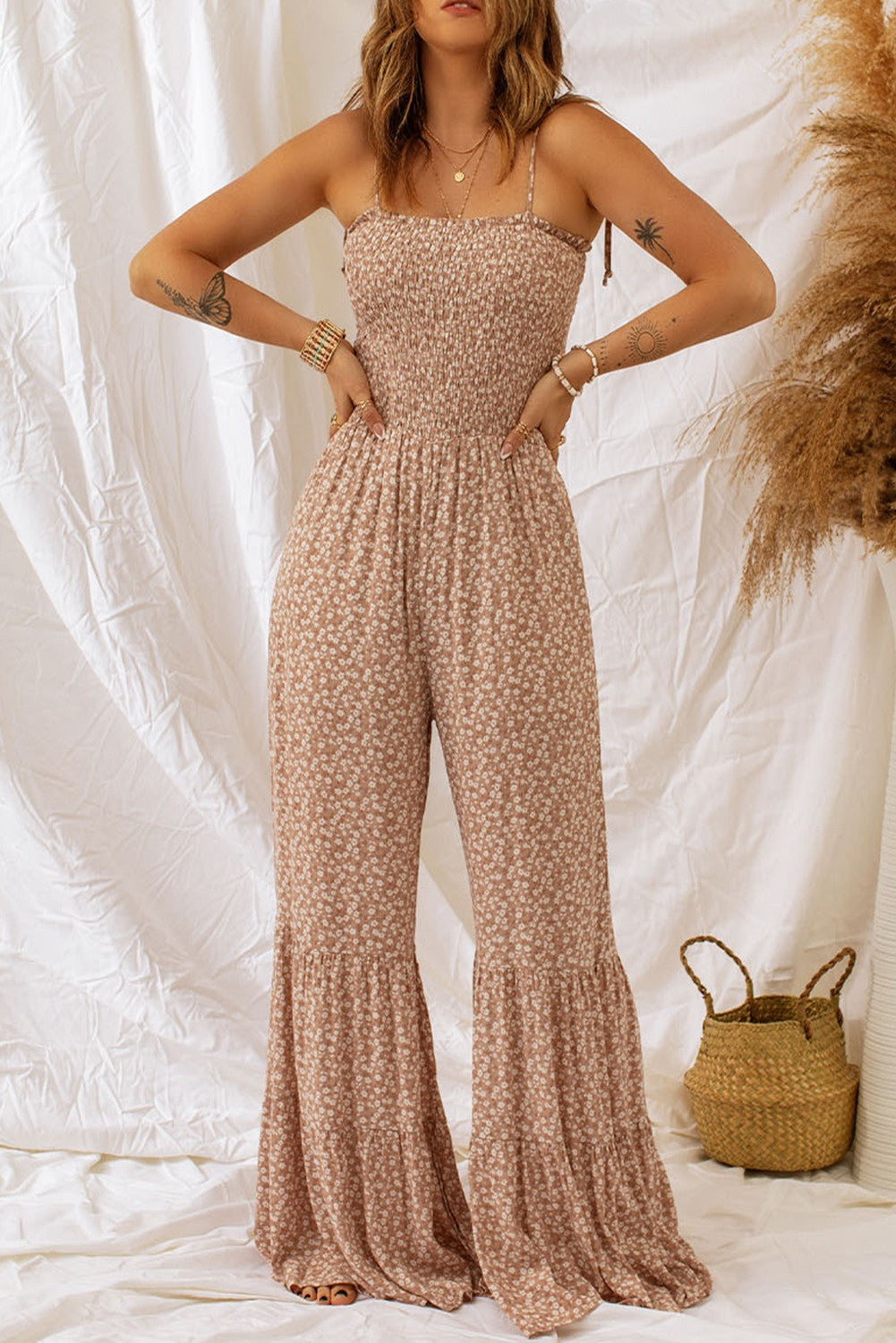 A stylish khaki floral print jumpsuit featuring spaghetti straps and a straight neckline, perfect for casual or formal occasions.