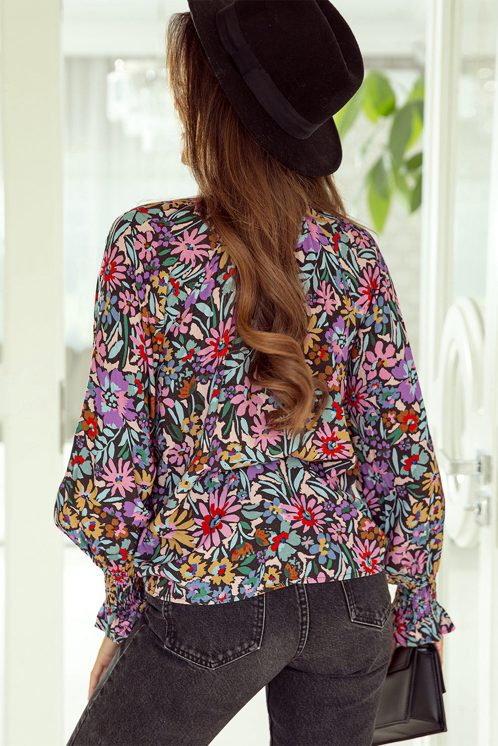 Floral Print Ruffled Long Sleeve V-Neck Blouse featuring a vibrant floral pattern and elegant ruffled details.