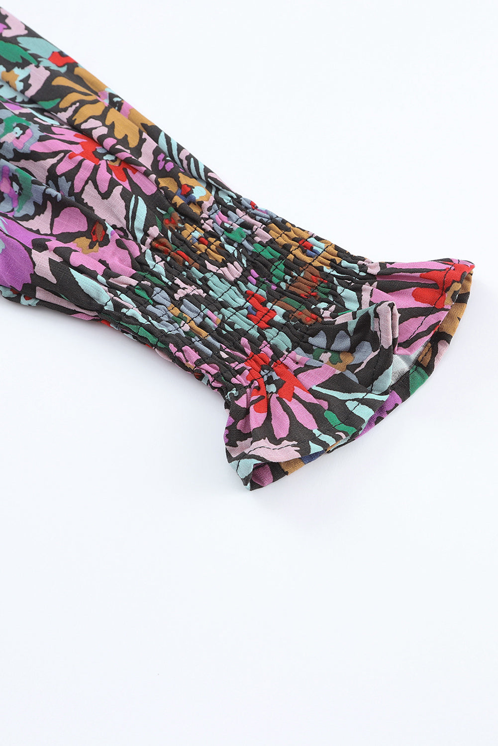 Floral Print Ruffled Long Sleeve V-Neck Blouse featuring a vibrant floral pattern and elegant ruffled details.