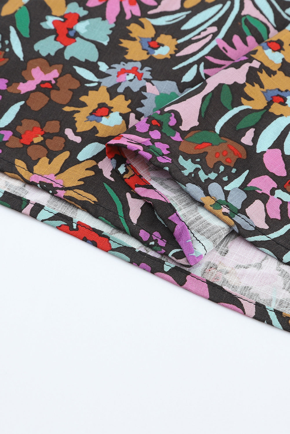 Floral Print Ruffled Long Sleeve V-Neck Blouse featuring a vibrant floral pattern and elegant ruffled details.