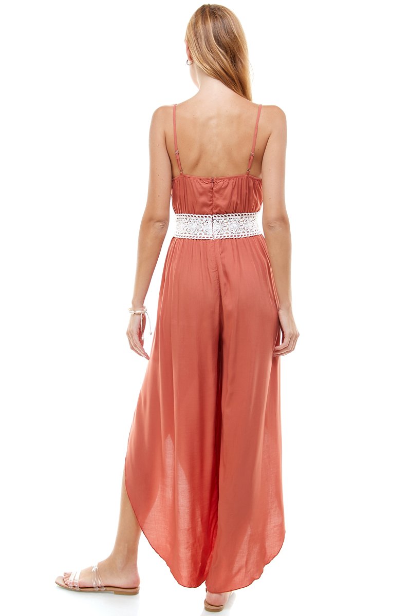 Floral and solid crochet tulip leg cami jumpsuit displayed on a model, showcasing its stylish design and flattering fit.