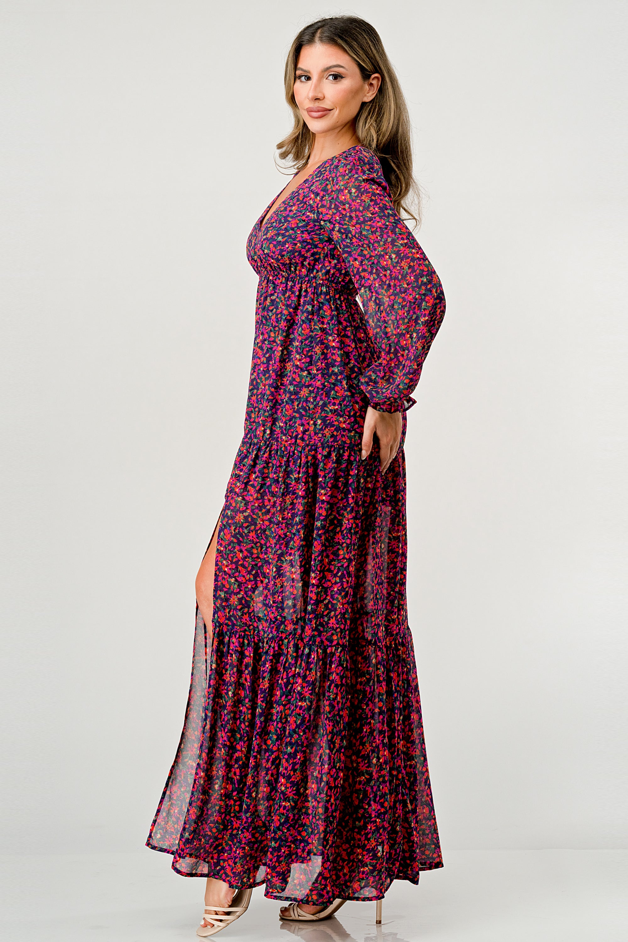 Floral V-Neck Long Sleeve Maxi Dress featuring a tiered skirt and side slit, elegantly displayed on a mannequin.