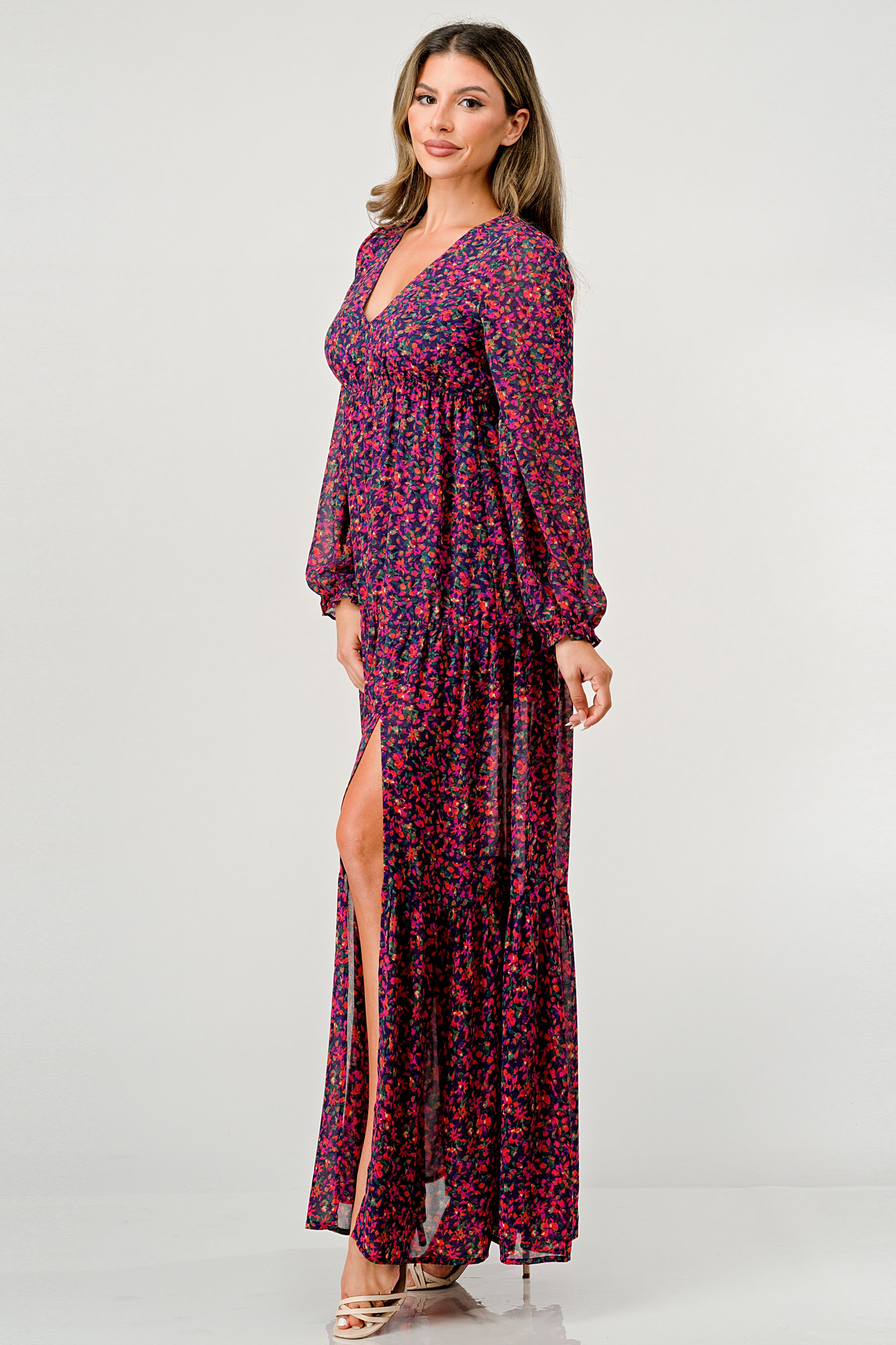 Floral V-Neck Long Sleeve Maxi Dress featuring a tiered skirt and side slit, elegantly displayed on a mannequin.