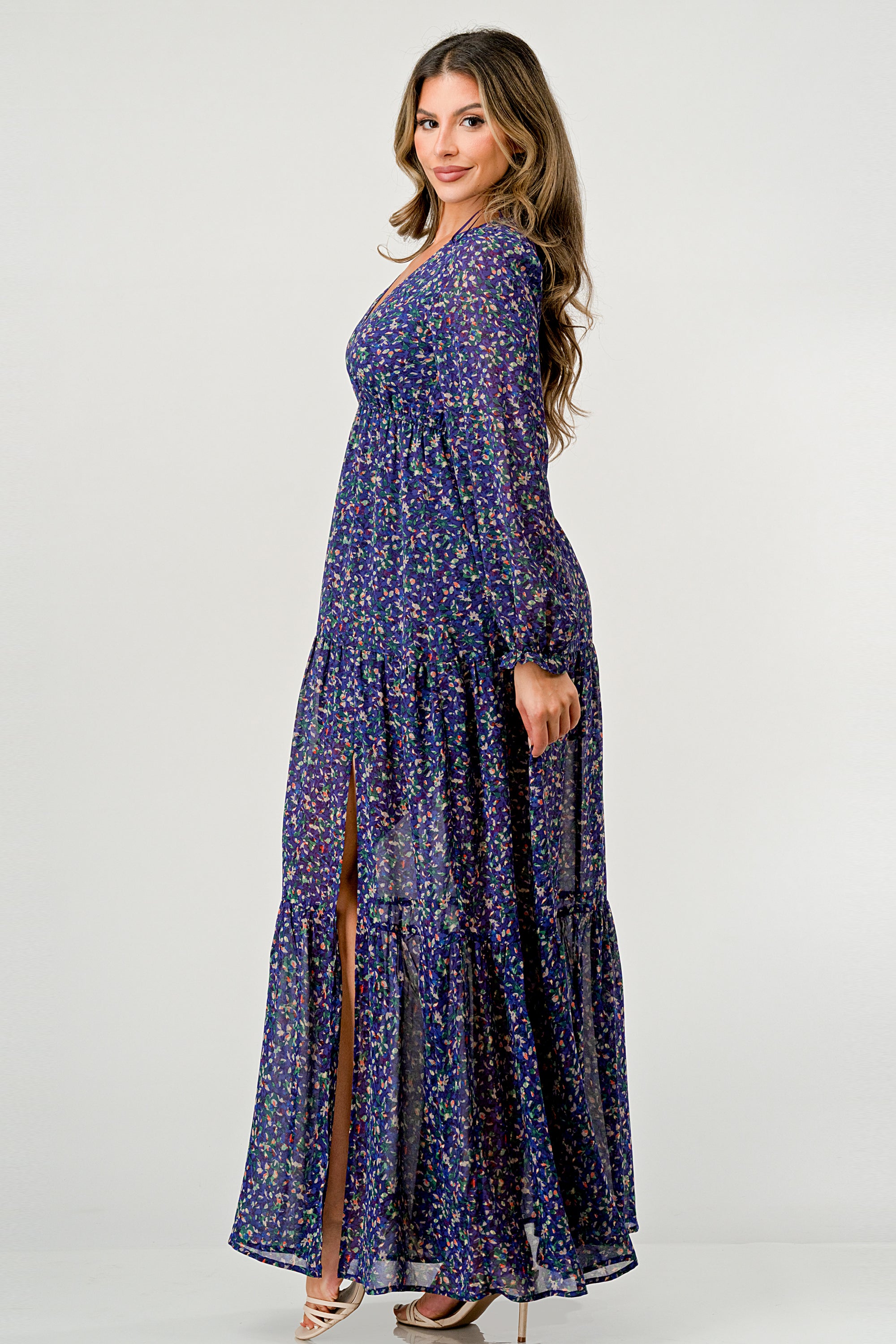 Floral V-Neck Long Sleeve Maxi Dress featuring a tiered skirt and side slit, elegantly displayed on a mannequin.