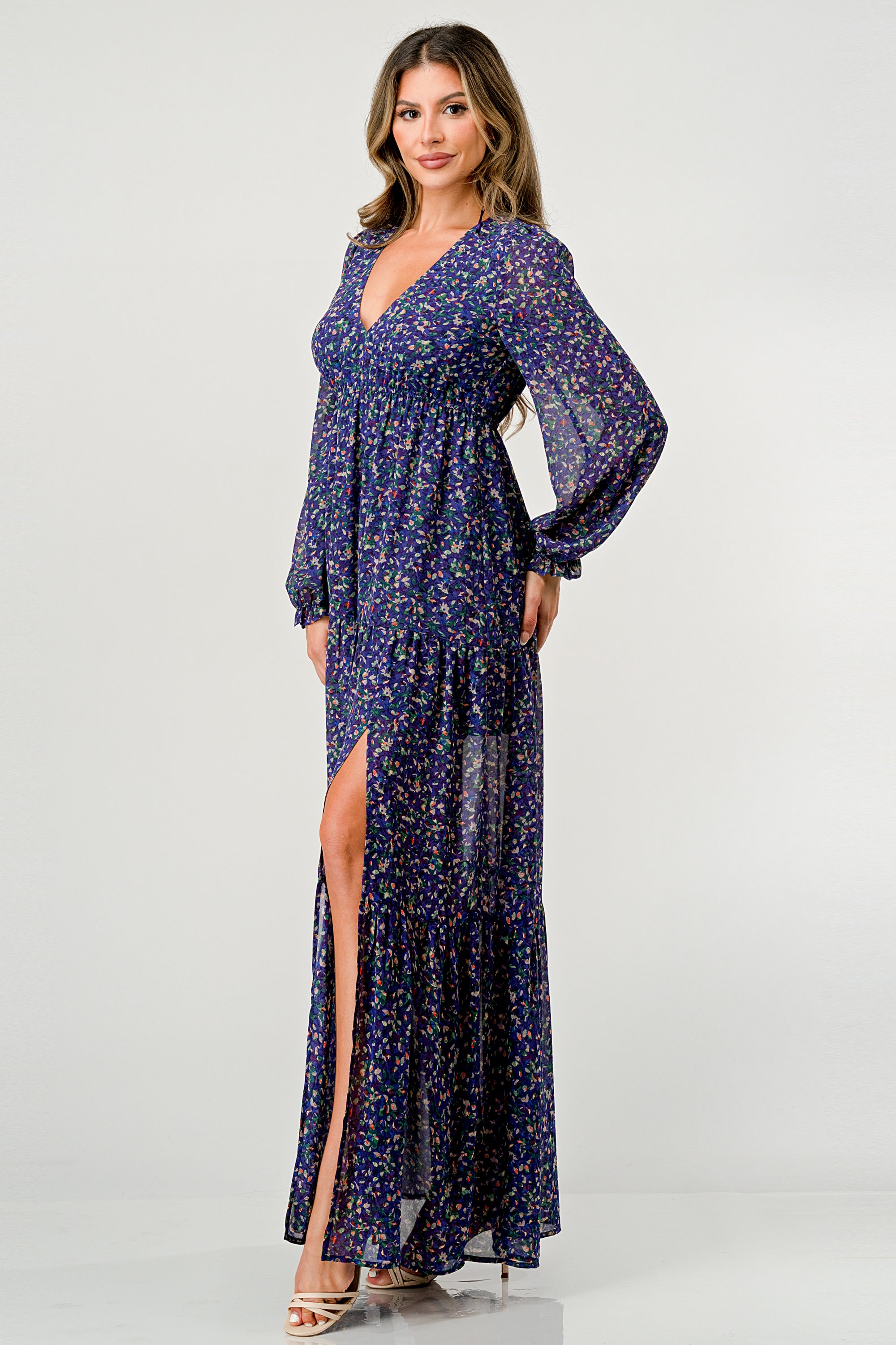 Floral V-Neck Long Sleeve Maxi Dress featuring a tiered skirt and side slit, elegantly displayed on a mannequin.