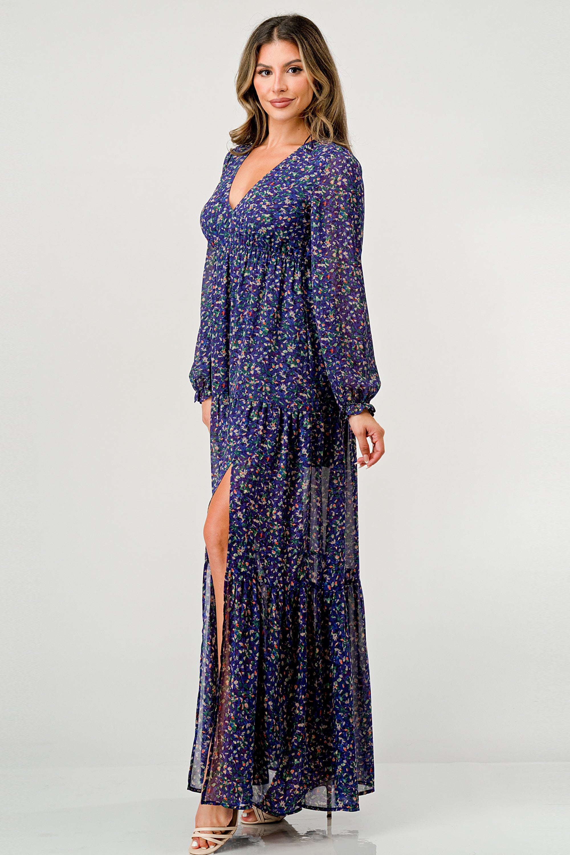 Floral V-Neck Long Sleeve Maxi Dress featuring a tiered skirt and side slit, elegantly displayed on a mannequin.