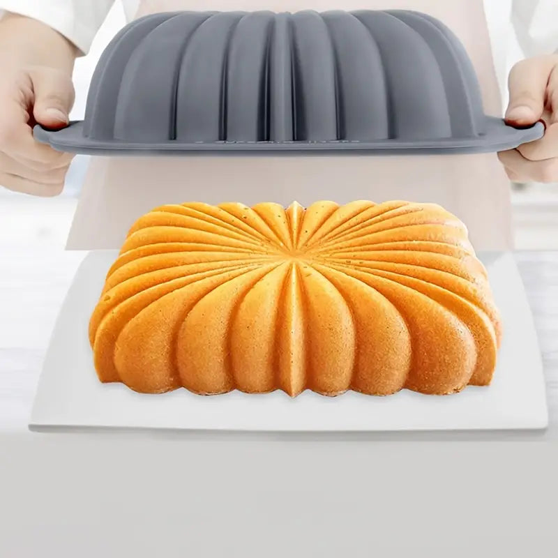 Flower shaped silicone cake pan in vibrant colors, showcasing its flexible design and non-stick surface.