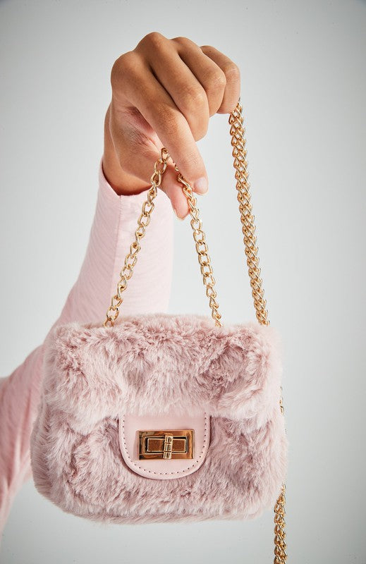 Fluffy Micro Mini Bag made of plush vegan fur and leather, featuring a chain strap and twist lock closure, designed in Australia.