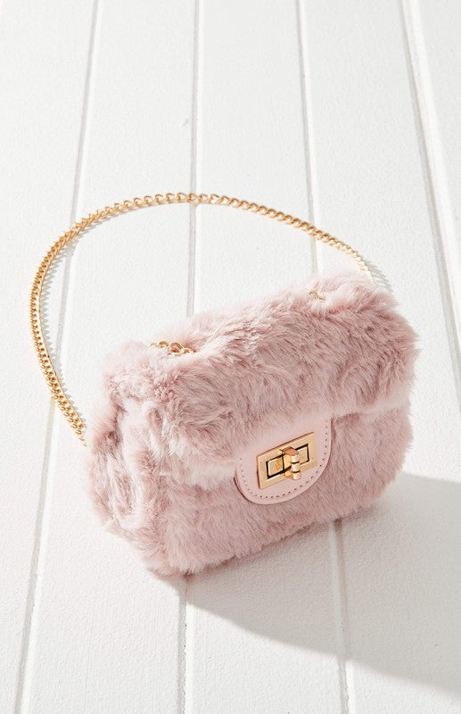 Fluffy Micro Mini Bag made of plush vegan fur and leather, featuring a chain strap and twist lock closure, designed in Australia.