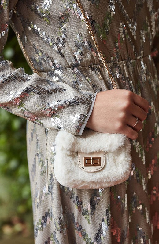 Fluffy Micro Mini Bag made of plush vegan fur and leather, featuring a chain strap and twist lock closure, designed in Australia.