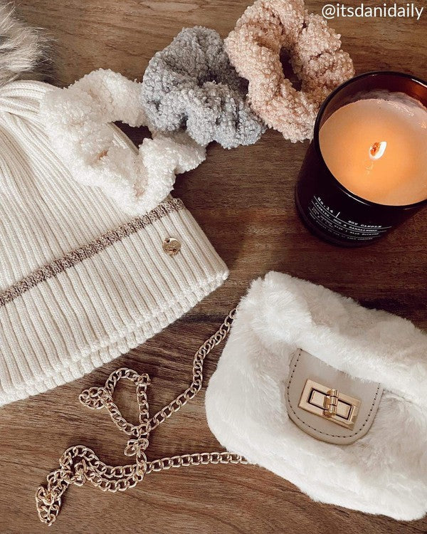 Fluffy Micro Mini Bag made of plush vegan fur and leather, featuring a chain strap and twist lock closure, designed in Australia.