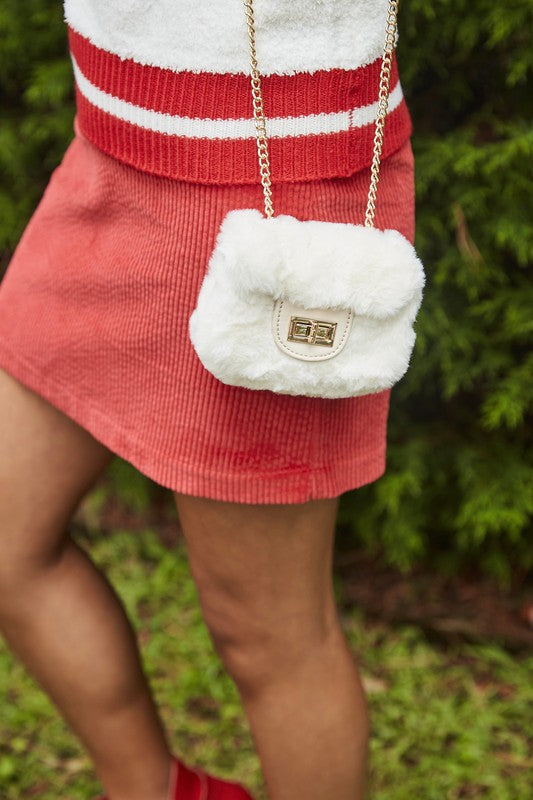 Fluffy Micro Mini Bag made of plush vegan fur and leather, featuring a chain strap and twist lock closure, designed in Australia.