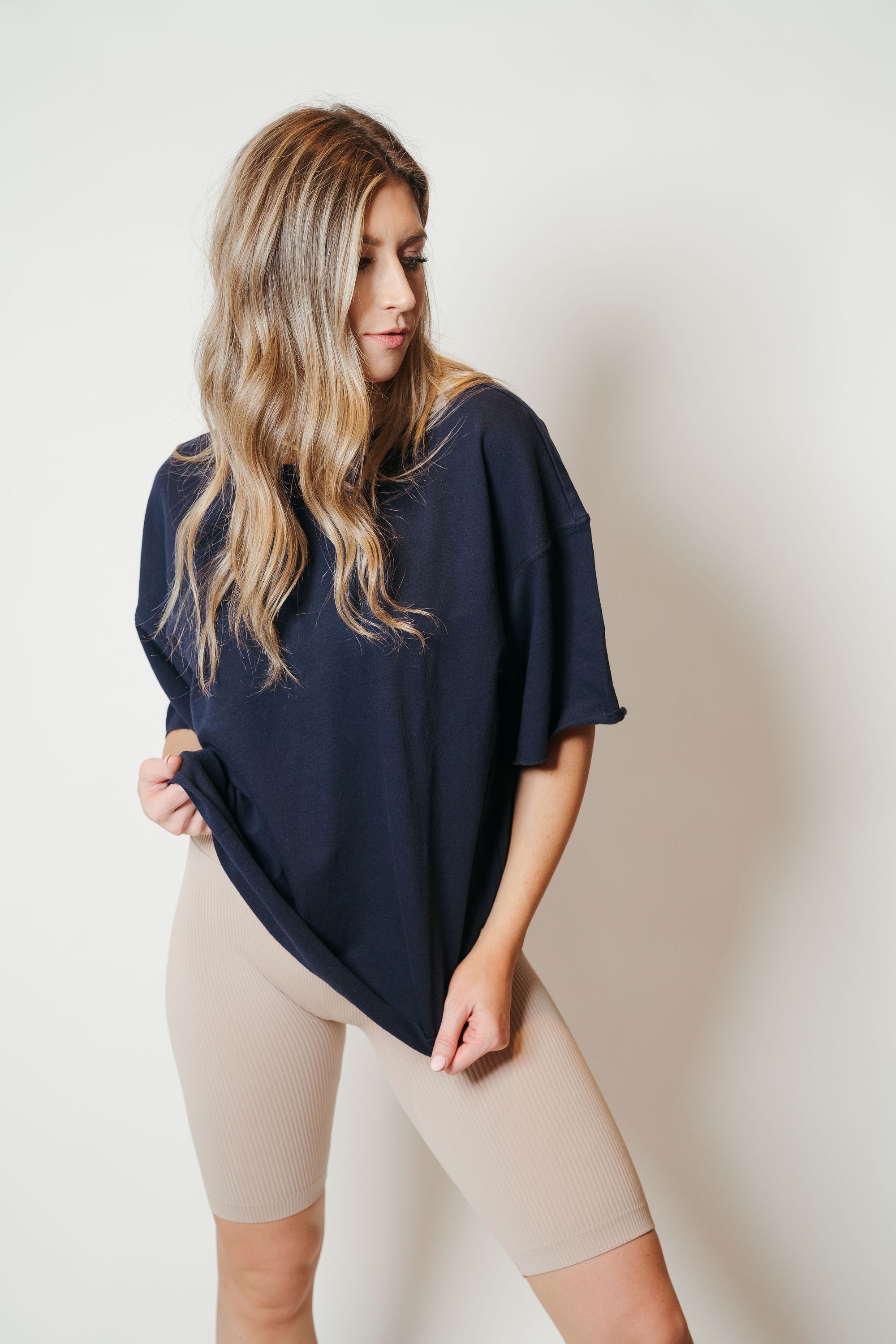 French Terry Raw Edge Comfort Top in Navy featuring drop shoulder design and raw edge details.