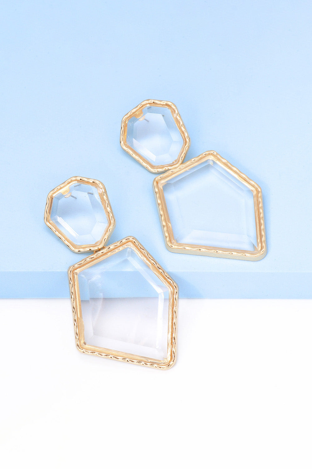 Geometrical shape dangle earrings made of zinc alloy and resin, showcasing a modern design with a unique frame.