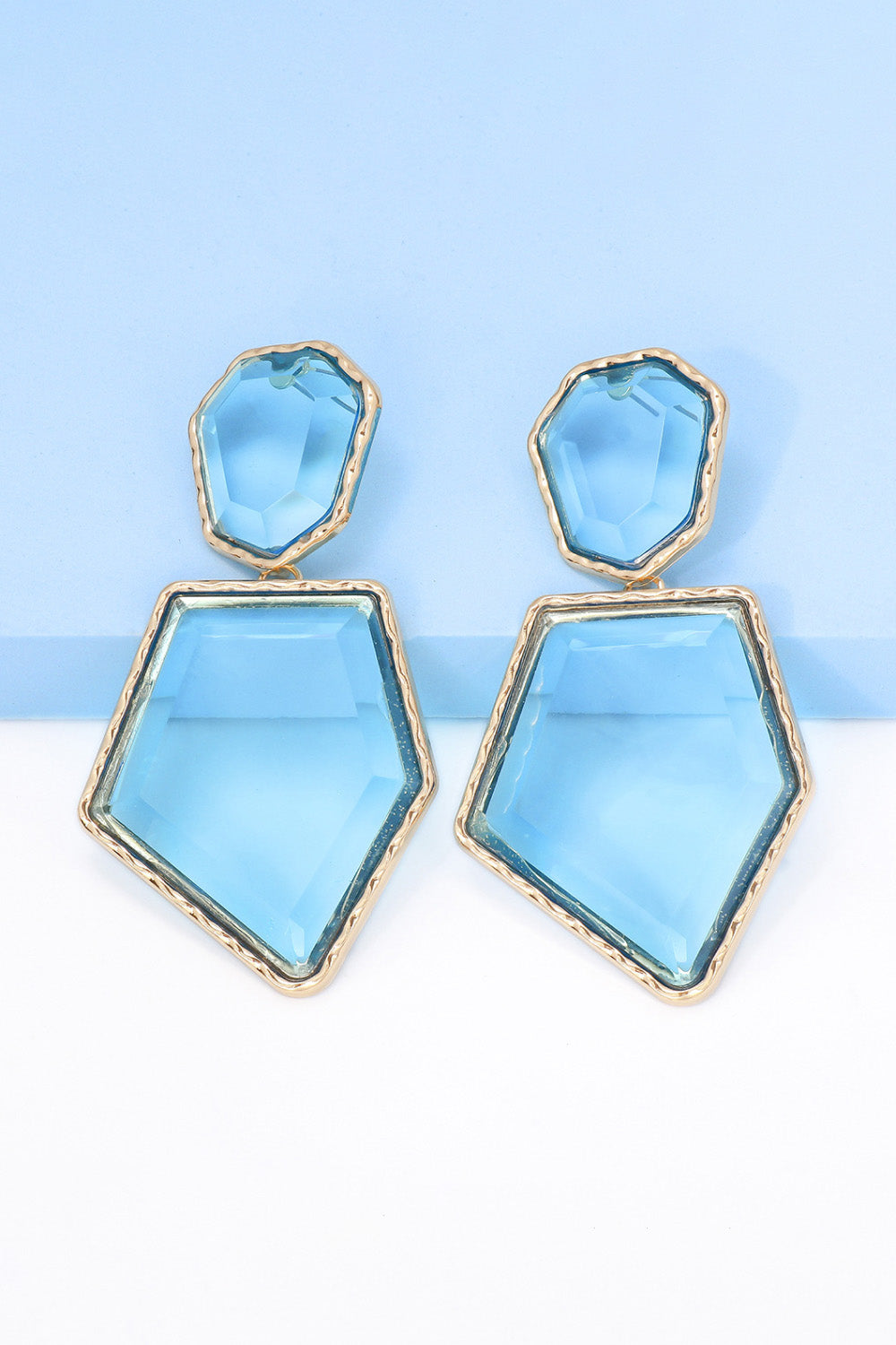 Geometrical shape dangle earrings made of zinc alloy and resin, showcasing a modern design with a unique frame.