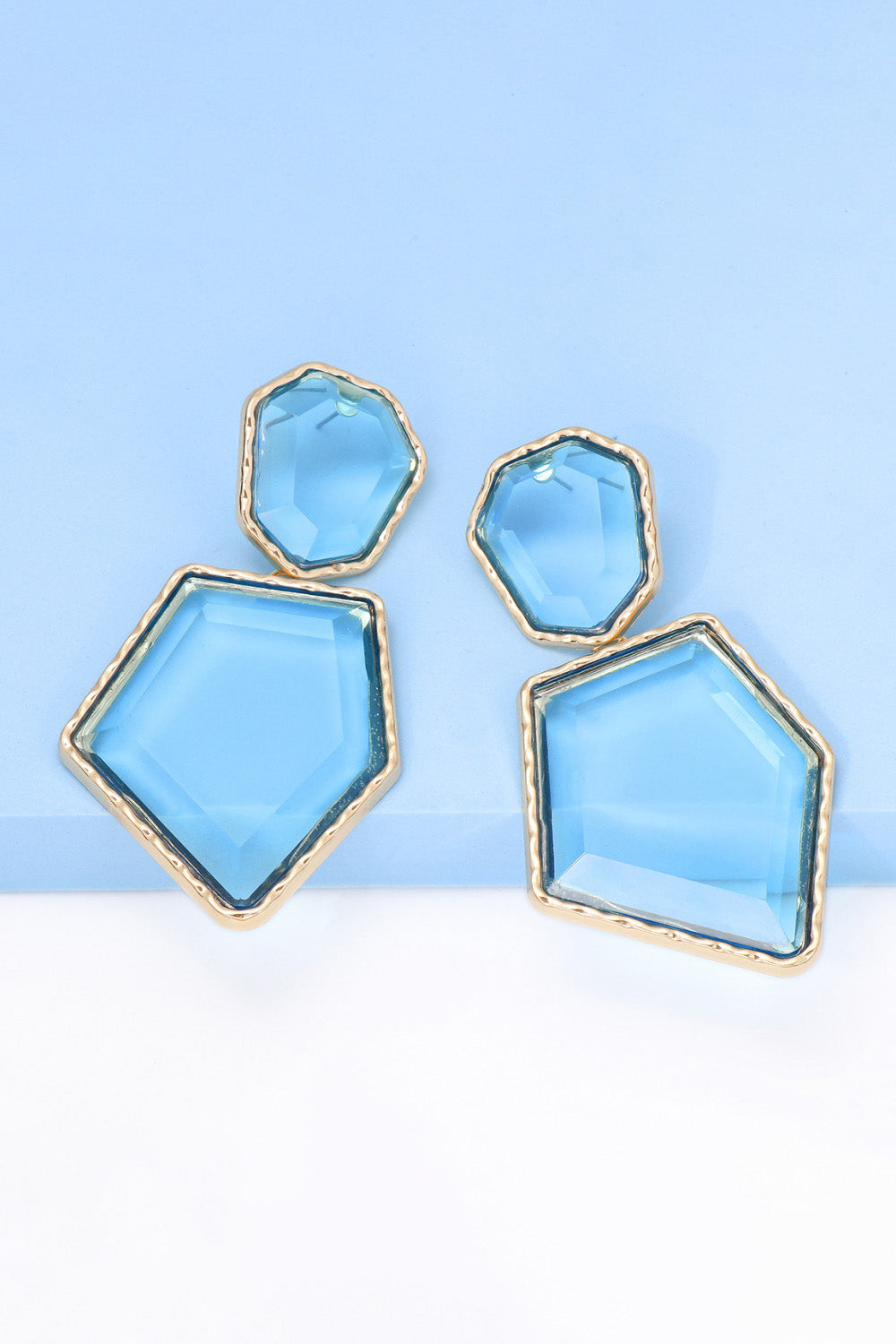 Geometrical shape dangle earrings made of zinc alloy and resin, showcasing a modern design with a unique frame.