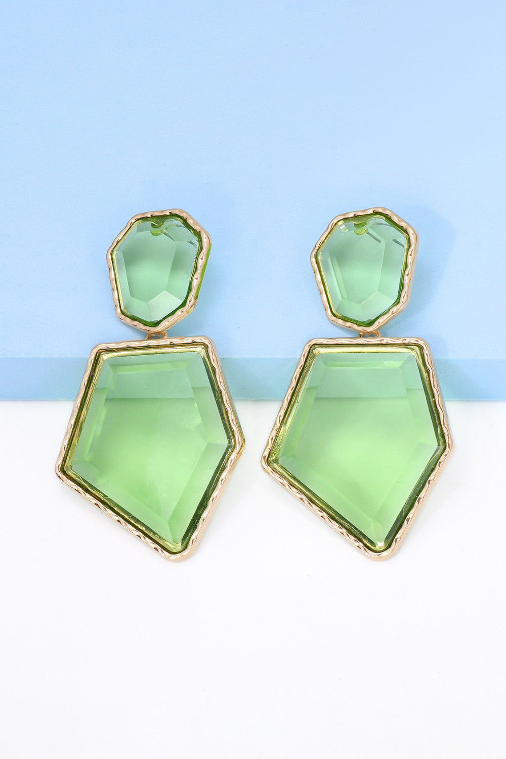 Geometrical shape dangle earrings made of zinc alloy and resin, showcasing a modern design with a unique frame.