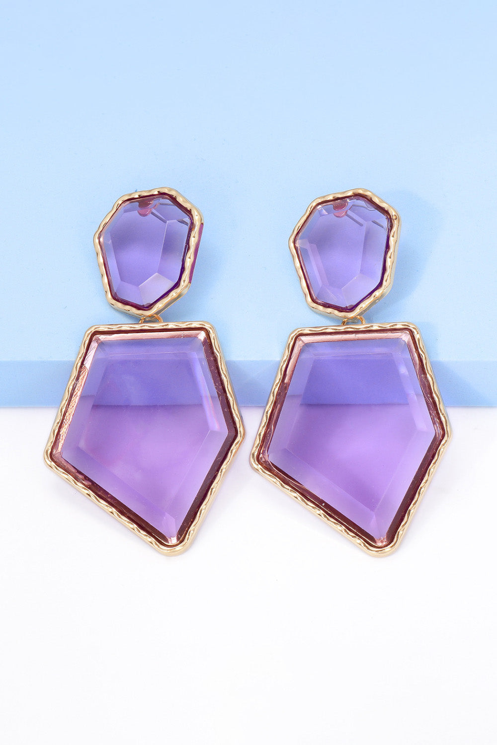 Geometrical shape dangle earrings made of zinc alloy and resin, showcasing a modern design with a unique frame.