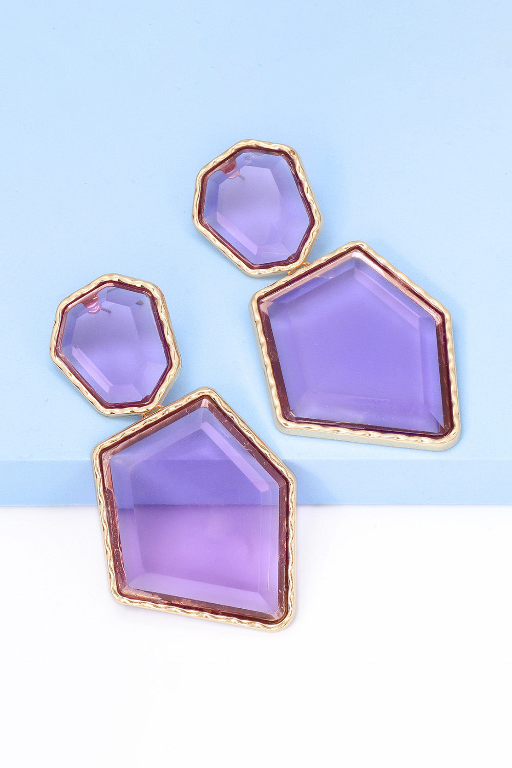 Geometrical shape dangle earrings made of zinc alloy and resin, showcasing a modern design with a unique frame.