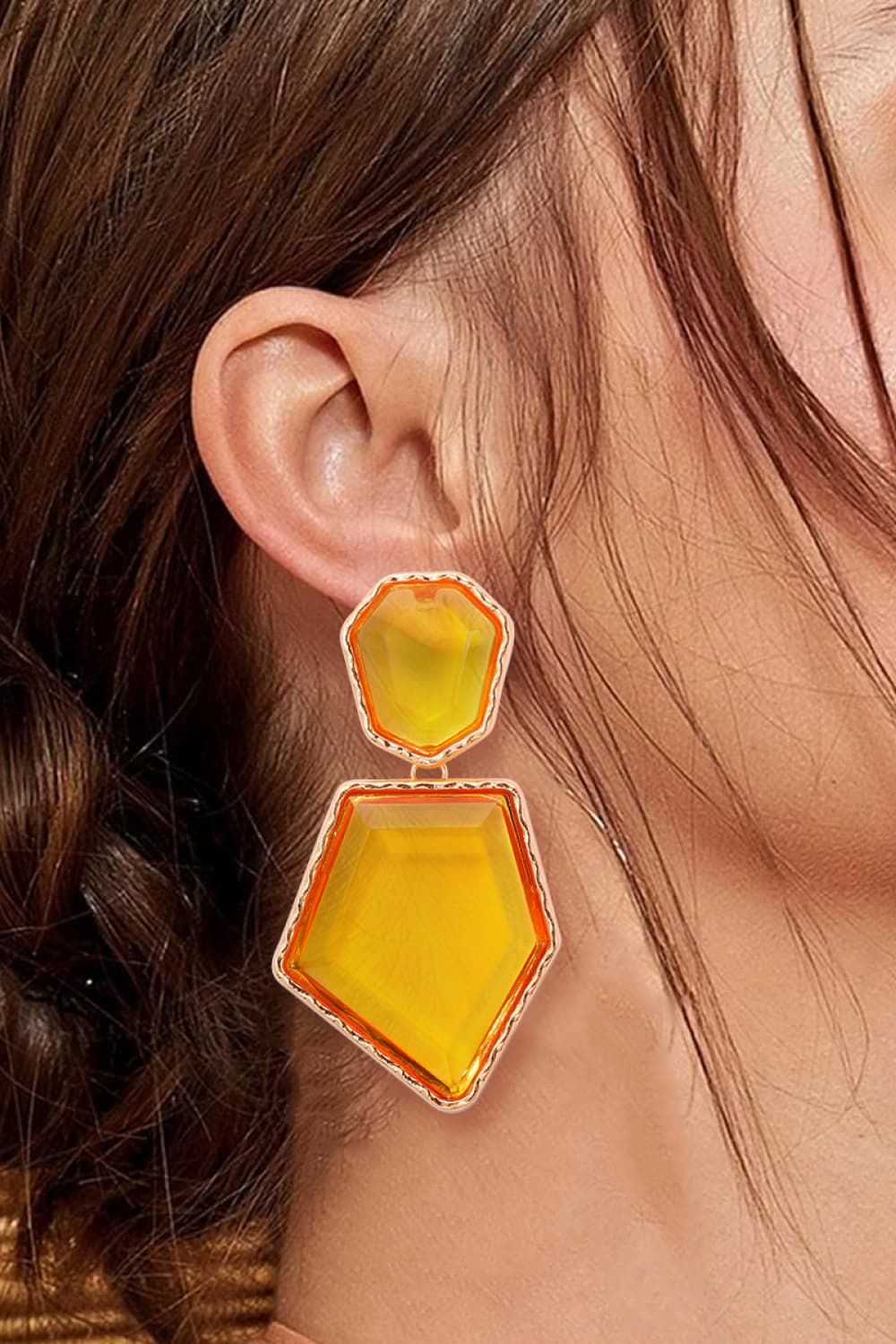 Geometrical shape dangle earrings made of zinc alloy and resin, showcasing a modern design with a unique frame.